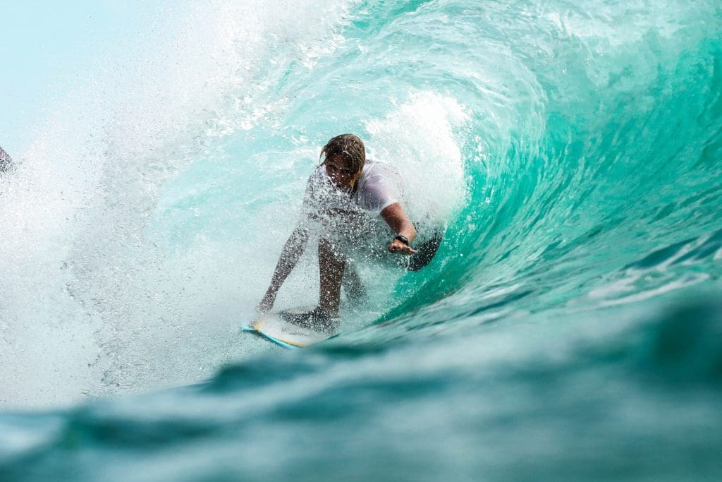 Surfer in barrel of water