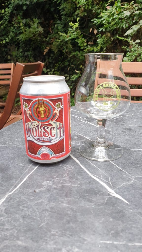 A can of Kolsch Beer & Glass in Billies Bottle Shop.