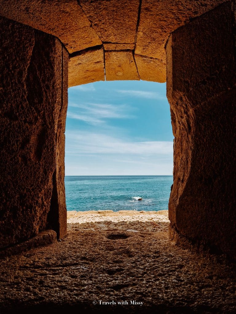 View through the stone window of Castello Maniace in Ortigia Syracuse.