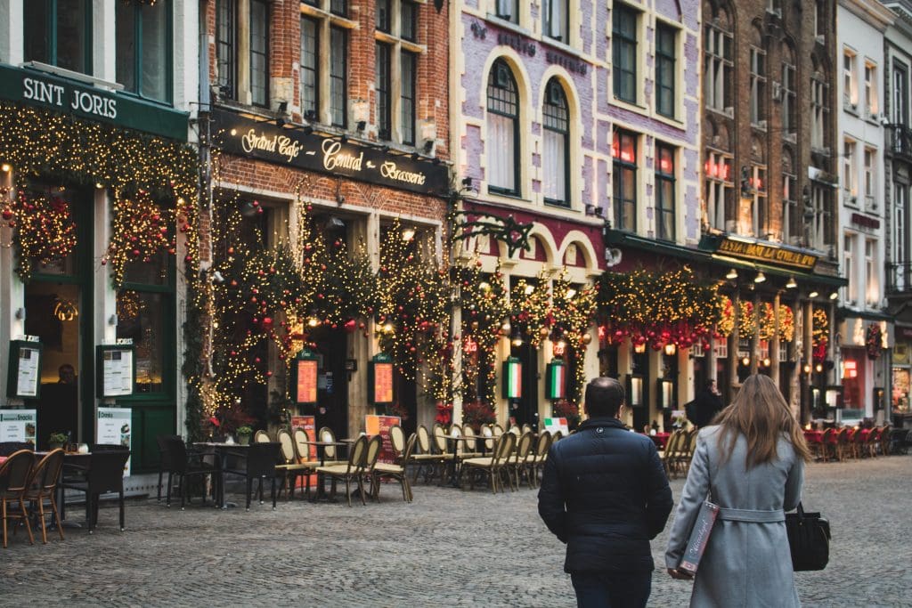 The festive stores and buildings of Bruges are decorated in lights and wreaths making it one of the Best European Cities for Christmas.